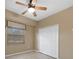 Spacious bedroom with ceiling fan and large closet at 26266 Barcelos Ct, Punta Gorda, FL 33983