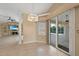 Spacious dining area with tile floors and sliding glass doors to the pool at 26266 Barcelos Ct, Punta Gorda, FL 33983