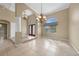 Spacious dining room with a chandelier and tiled floors at 26266 Barcelos Ct, Punta Gorda, FL 33983