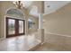 Elegant dining room featuring a chandelier and tiled floors at 26266 Barcelos Ct, Punta Gorda, FL 33983