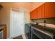 Laundry room with washer, dryer, and cabinets at 26266 Barcelos Ct, Punta Gorda, FL 33983