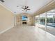 Living room with fireplace, tile floors, and pool view at 26266 Barcelos Ct, Punta Gorda, FL 33983