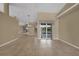 Bright living room with tile floors, fireplace, and sliding glass doors leading to pool at 26266 Barcelos Ct, Punta Gorda, FL 33983