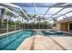 Resort-style pool and spa with screened enclosure at 26266 Barcelos Ct, Punta Gorda, FL 33983