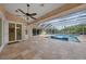 Inviting pool area with covered patio and spa at 26266 Barcelos Ct, Punta Gorda, FL 33983