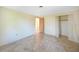 Bright bedroom with tile floors and spacious closet at 272 Cedar St, Englewood, FL 34223