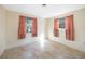 Well-lit bedroom featuring tile floors and ample natural light at 272 Cedar St, Englewood, FL 34223