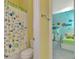 Bathroom with shower/tub combo and fish-themed decor at 2864 Mill Creek Rd, Port Charlotte, FL 33953