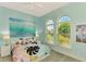 Bedroom with ocean-themed art and carpet at 2864 Mill Creek Rd, Port Charlotte, FL 33953