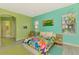 Bedroom with bright walls and tropical bedding at 2864 Mill Creek Rd, Port Charlotte, FL 33953