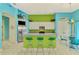 Bright kitchen with stainless steel appliances and green breakfast bar at 2864 Mill Creek Rd, Port Charlotte, FL 33953