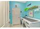 Laundry room with washer, dryer and shelving at 2864 Mill Creek Rd, Port Charlotte, FL 33953