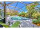 Enjoy this screened-in pool and spa with plenty of lounge chairs at 2864 Mill Creek Rd, Port Charlotte, FL 33953