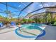 Enjoy this relaxing pool and spa with a screened enclosure at 2864 Mill Creek Rd, Port Charlotte, FL 33953