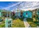 Landscaped backyard with multiple sheds and pathways at 2871 13Th St, Englewood, FL 34224