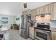 Stainless steel appliances and light wood cabinets in kitchen at 2871 13Th St, Englewood, FL 34224