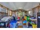 Interior of cluttered storage shed with various items at 2871 13Th St, Englewood, FL 34224