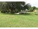 Large backyard with lush grass and water view at 4064 Harbor Blvd, Port Charlotte, FL 33952