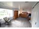 Main bedroom with a wooden bed frame, wardrobe, and rocking chair at 4064 Harbor Blvd, Port Charlotte, FL 33952