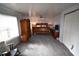 Main bedroom with a wooden bed frame, wardrobe, and rocking chair at 4064 Harbor Blvd, Port Charlotte, FL 33952