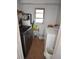 Compact laundry room area with washer, dryer, and utility sink at 4064 Harbor Blvd, Port Charlotte, FL 33952