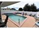 Inviting pool area with lounge chairs and patio furniture at 4064 Harbor Blvd, Port Charlotte, FL 33952