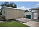 Tan colored storage shed with double doors and ramp at 4064 Harbor Blvd, Port Charlotte, FL 33952