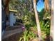 Brick pathway meanders through a lush tropical garden at 421 Riviera St, Venice, FL 34285