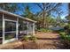 Screened porch with garden views in a private backyard setting at 421 Riviera St, Venice, FL 34285