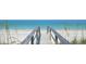 Wooden walkway leading to a pristine beach at 421 Riviera St, Venice, FL 34285