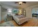 Cozy bedroom with hardwood floors and access to sunroom at 421 Riviera St, Venice, FL 34285