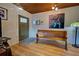 Entryway with wood bench, wood floors, and wood ceilings at 421 Riviera St, Venice, FL 34285