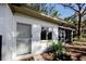 House exterior showcases a light-grey door and screened porch at 421 Riviera St, Venice, FL 34285