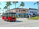 Sarasota Trolley on a street with shops and palm trees at 421 Riviera St, Venice, FL 34285