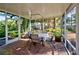 Enjoy outdoor dining in this screened porch with brick flooring at 421 Riviera St, Venice, FL 34285