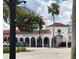 White building with arched entryway and hanging flowers at 421 Riviera St, Venice, FL 34285