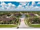 Aerial view of community, featuring lake and homes at 4370 Turnberry Cir, North Port, FL 34288