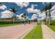 Gated community entrance with lush landscaping at 4370 Turnberry Cir, North Port, FL 34288