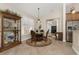 Casual dining area with wood table, chairs, and display cabinet at 4370 Turnberry Cir, North Port, FL 34288