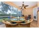 Bright screened porch, perfect for dining al fresco at 4370 Turnberry Cir, North Port, FL 34288