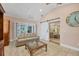 Open living room featuring a sliding barn door and a comfy sofa at 4557 Colleen St, Port Charlotte, FL 33952