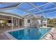 Inviting swimming pool with a screened enclosure at 4557 Colleen St, Port Charlotte, FL 33952