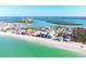 Wide aerial view of coastal town, highlighting beach and various properties at 50 Meredith Dr # 12, Englewood, FL 34223