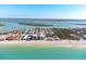 Wide aerial view of beachfront homes and ocean at 50 Meredith Dr # 12, Englewood, FL 34223