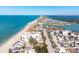 Long aerial view of beachfront community, ocean, and bay at 50 Meredith Dr # 12, Englewood, FL 34223