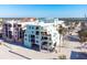 Aerial view of beachfront property, showcasing building and surrounding area at 50 Meredith Dr # 12, Englewood, FL 34223