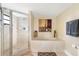 Bathroom with shower and a soaking tub at 50 Meredith Dr # 12, Englewood, FL 34223