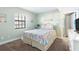 Bedroom with coastal decor and ocean view at 50 Meredith Dr # 12, Englewood, FL 34223