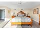 Bright bedroom with a king-size bed and ceiling fan at 50 Meredith Dr # 12, Englewood, FL 34223