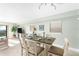 Simple dining room featuring a wooden table with seating for six at 50 Meredith Dr # 12, Englewood, FL 34223